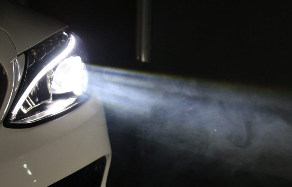 close up of Ford sedan headlights
